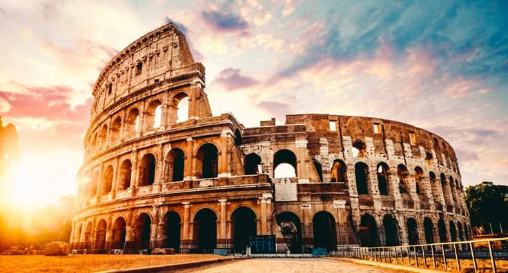 Magnificent Roman Colosseum amphitheater at golden sunset with ancient architecture and dramatic sky - historic Rome landmark