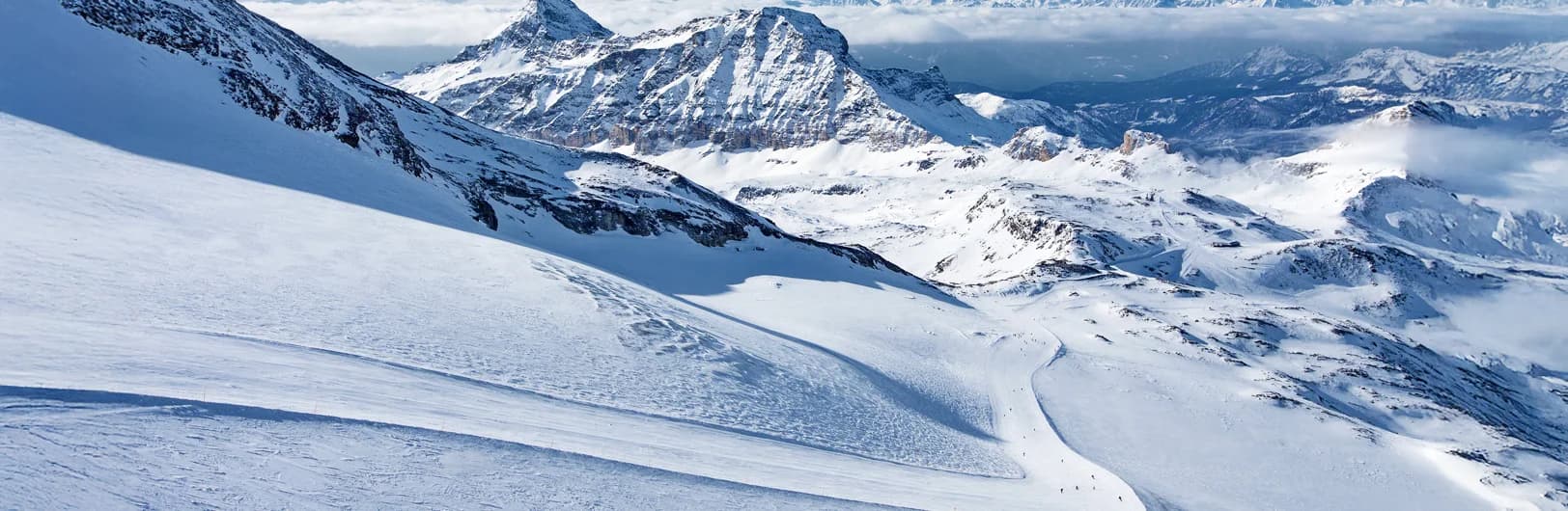 Cervinia Breuil-Cervinia ski resort beneath iconic Matterhorn mountain in Aosta Valley with year-round glacier skiing, high-altitude slopes connecting to Zermatt Switzerland