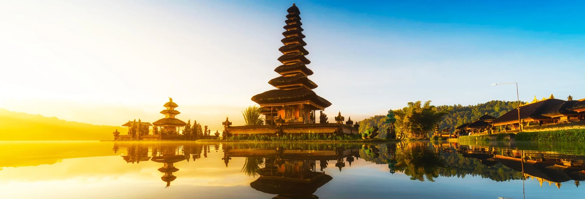 Bali Indonesia in November 2025 - terraced rice paddies in Ubud, Tanah Lot temple at sunset, Uluwatu clifftop views, traditional Balinese temples, Galungan festival celebrations, and tropical beaches during dry season best time to visit