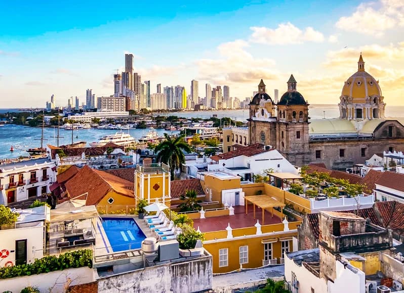 Colombia in November 2025 - vibrant Cartagena colonial Old City with colorful Spanish architecture, Caribbean coastal fortresses, lush Coffee Triangle plantations, Bogotá street art in Candelaria district, and Tayrona National Park beaches during shoulder season perfect weather