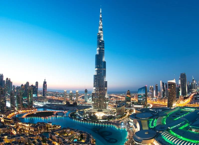Dubai UAE in November 2025 - futuristic skyline with iconic Burj Khalifa tower at golden sunset, Palm Jumeirah artificial island, luxury desert safari dune bashing, traditional Gold Souk markets, and Abu Dhabi Grand Prix during post-summer comfortable weather season