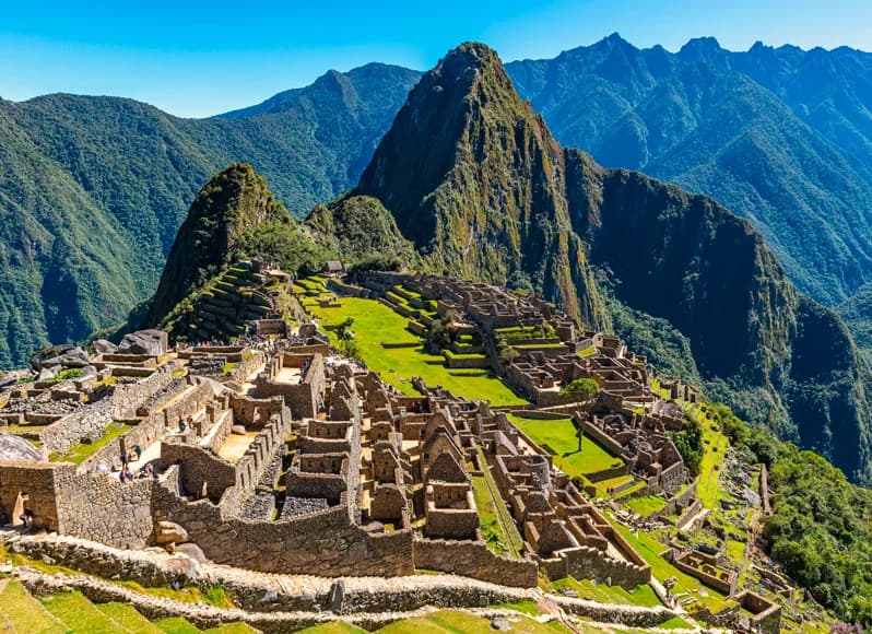 Peru in November 2025 - iconic Machu Picchu ancient Inca citadel at sunrise with dramatic Andean mountain peaks, Sacred Valley terraced ruins, Rainbow Mountain colorful slopes, Amazon rainforest jungle lodges in Tambopata, and Lima gastronomy scene during shoulder season value