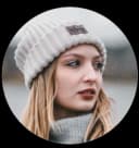 Sarah Mitchell - Canadian ski expert and winter sports journalist specializing in Canadian Rockies ski resorts, photographed outdoors wearing adventure gear with mountain scenery in background