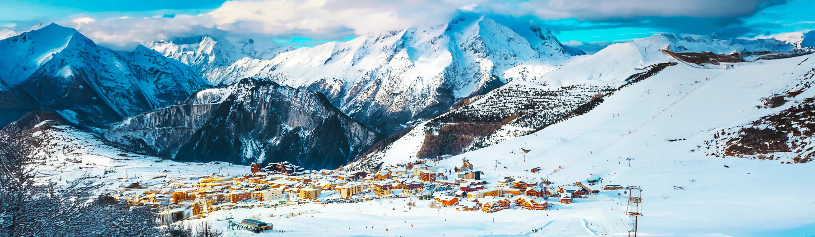 Best ski resorts in Europe 2025/26 winter season - stunning aerial panorama of snow-covered European Alps mountain ranges featuring iconic Matterhorn peak in Switzerland, Mont Blanc massif in France, dramatic Dolomites limestone towers in Italy, Arlberg powder slopes in Austria, and sunny Pyrenees in Andorra with modern cable cars, groomed ski runs, and traditional alpine villages nestled in pristine valleys