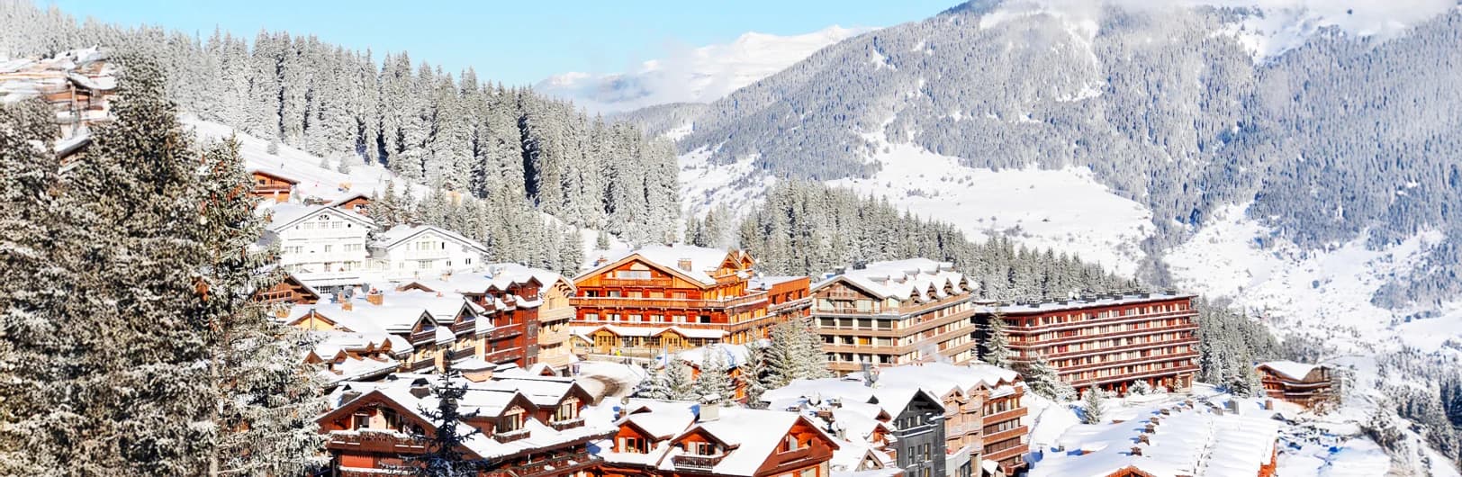 Courchevel 1850 luxury ski resort France - exclusive Trois Vallées ski area with 600km interconnected slopes, 5-star hotels, glamorous chalets, designer boutiques on La Croisette, 7 Michelin-starred restaurants, perfectly manicured pistes, helicopter landing pad, and upscale French Alps skiing experience 2026