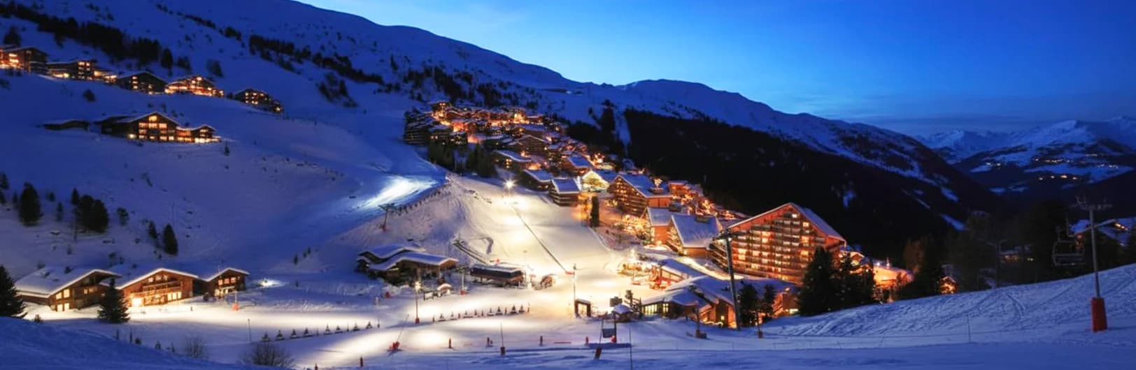 Méribel ski resort France - central Trois Vallées location with 600km ski domain access, traditional Savoyard chalet architecture, family-friendly tree-lined slopes, British ski favorite, Mont Vallon 2,952m summit, catered chalets, authentic Alpine village charm, and intermediate skiing paradise 2026