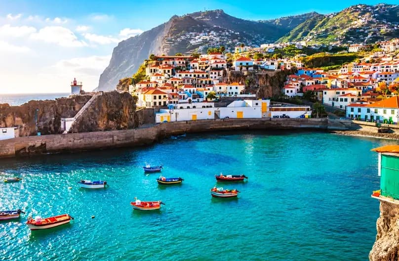 Madeira Portugal travel guide 2026: volcanic coastline, FREE Porto Moniz natural pools, UNESCO levada trails, Funchal Monte cable car, Camara de Lobos fishing village - 16+ verified hotels from €37/night with insider tips