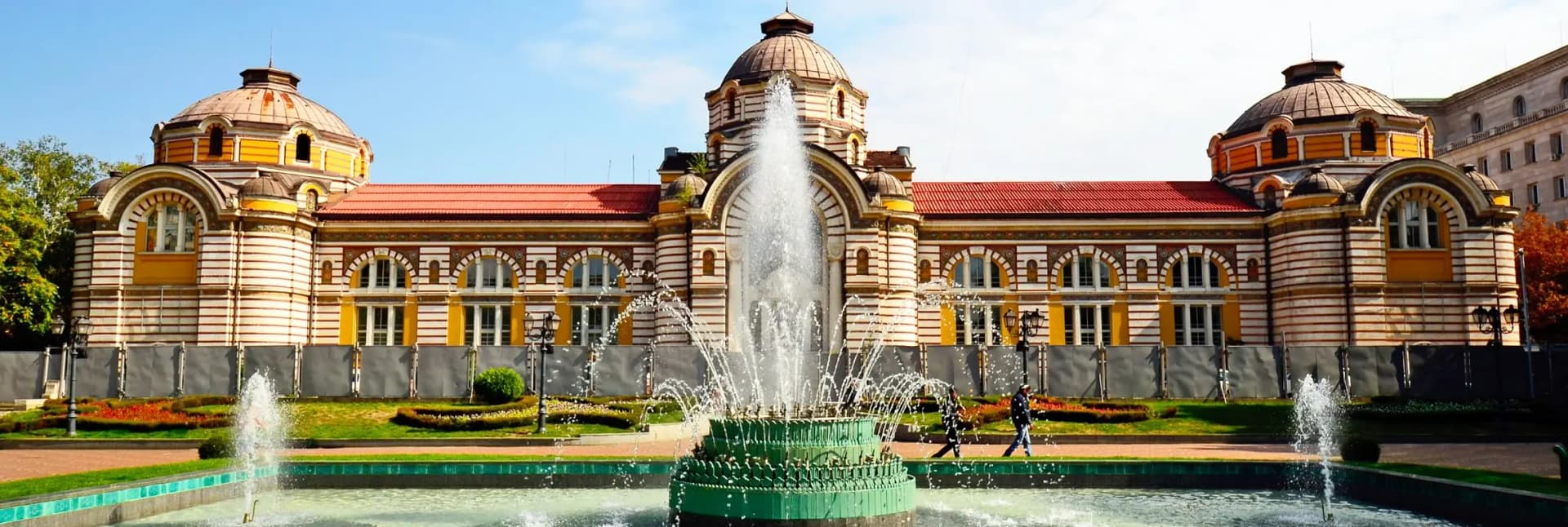 Izgrev residential district Sofia Bulgaria 2026 - quiet neighborhood with direct M1 metro line to Sofia Airport, budget business hotels €40-65 per night, local Bulgarian restaurants, 15 minutes to city center - best area for early morning flights and airport convenience