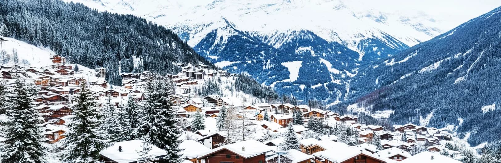 Verbier ski resort Switzerland Four Valleys - expert freeride off-piste terrain with steep couloirs, Mont Fort glacier peak at 3330m, luxury alpine village with chalets, powder skiing runs, and dramatic Swiss Alps mountain scenery for advanced skiers winter 2026